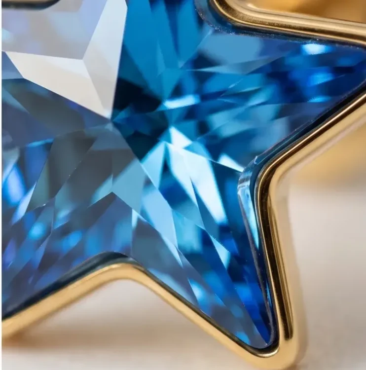 Pozłacane srebrne kolczyki z kryształową gwiazdką Swarovski® Bermuda Blue, idealne na prezent dla kobiety.