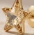 Kolczyki gwiazdki z kryształami Swarovski® Golden Shadow, srebro 925 pozłacane i ciepły złocisty blask.