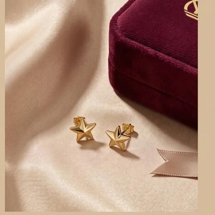 Złote kolczyki na sztyfcie LUMIERE z kryształami Swarovski® Aurum w kształcie gwiazdki