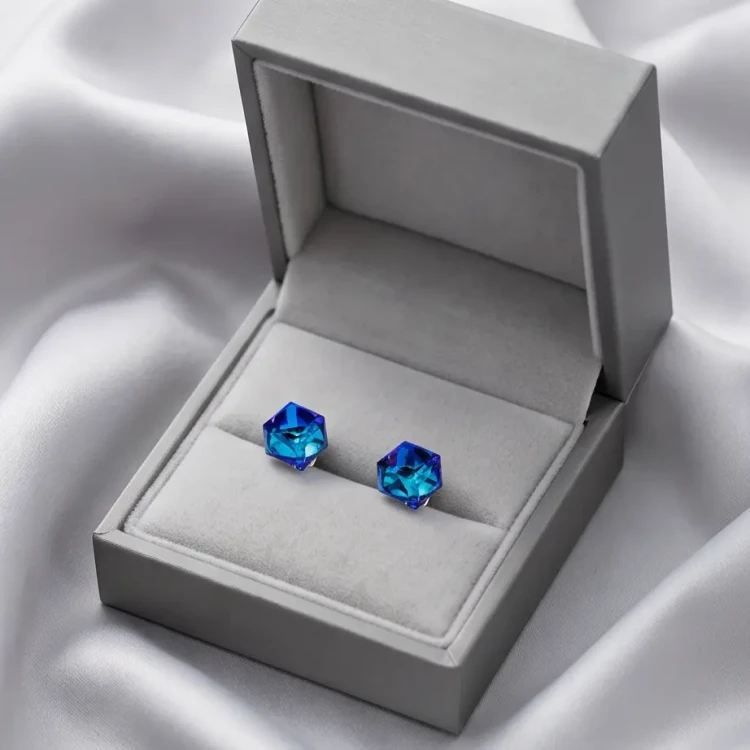 Geometryczne kolczyki damskie z niebieskimi kryształami Swarovski® i platynowym wykończeniem
