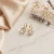 Eleganckie kolczyki srebrne pozłacane z lśniącymi kryształami Swarovski® w kolorze Crystal