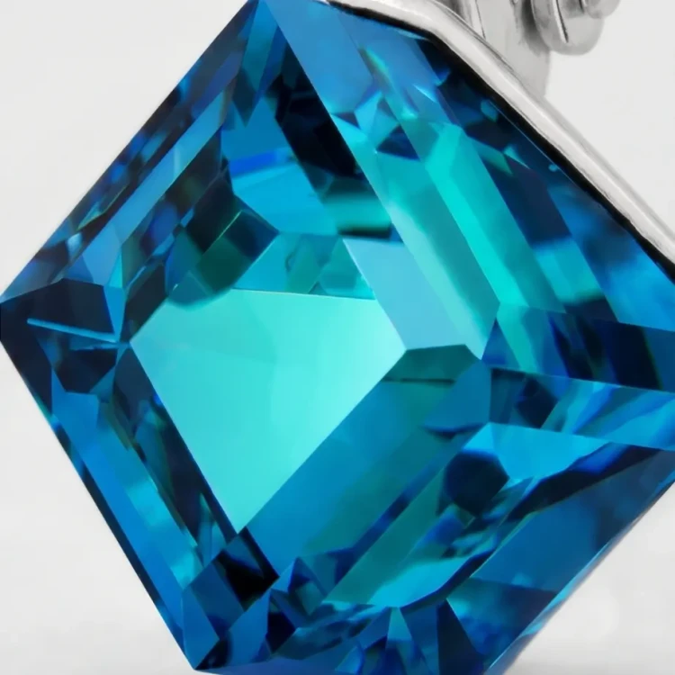 Eleganckie srebrne kolczyki z lśniącymi kostkami Swarovski® 8 mm Bermuda Blue