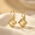 Pozłacane kolczyki z kryształami Swarovski® w kształcie kostek Golden Shadow