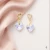 Damskie kolczyki srebrne pozłacane z opalizującymi kryształami Swarovski® serce