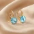Kolczyki srebrne pozłacane z błękitnymi kryształami Swarovski® Light Turquoise