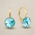 Okrągłe kolczyki z kryształami Swarovski® Light Turquoise i pozłacanym srebrem