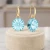 Damskie kolczyki srebrne pozłacane z błękitnymi kryształami Swarovski® 10 mm
