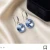 Kolczyki damskie wiszące z kryształami Swarovski® 10 mm w jasnoszafirowym odcieniu