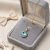 Naszyjnik z pozłacanego srebra z okrągłym kryształem Swarovski® Light Turquoise