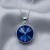 Elegancki srebrny naszyjnik z okrągłym kryształem Swarovski® w kolorze Sapphire