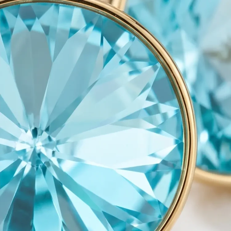 Damskie kolczyki srebrne pozłacane z jasnoturkusowymi kryształami Swarovski®