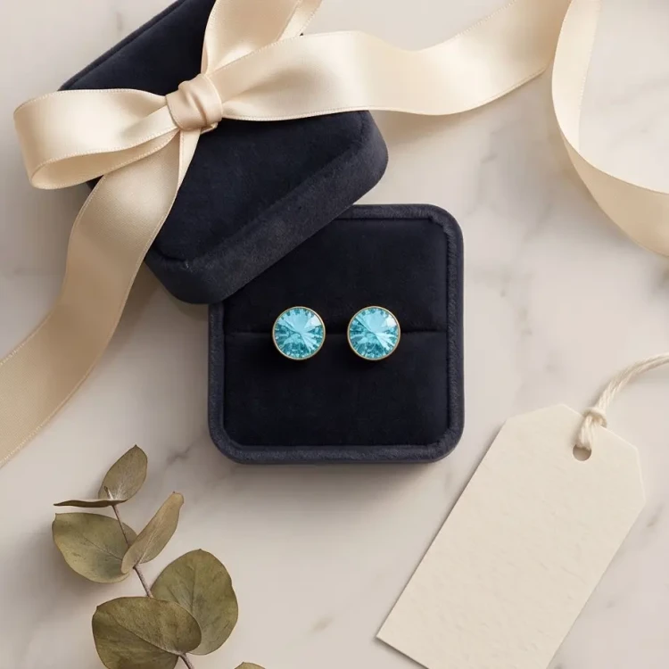 Delikatne kolczyki srebrne pozłacane z błękitno-turkusowymi kryształami Swarovski®